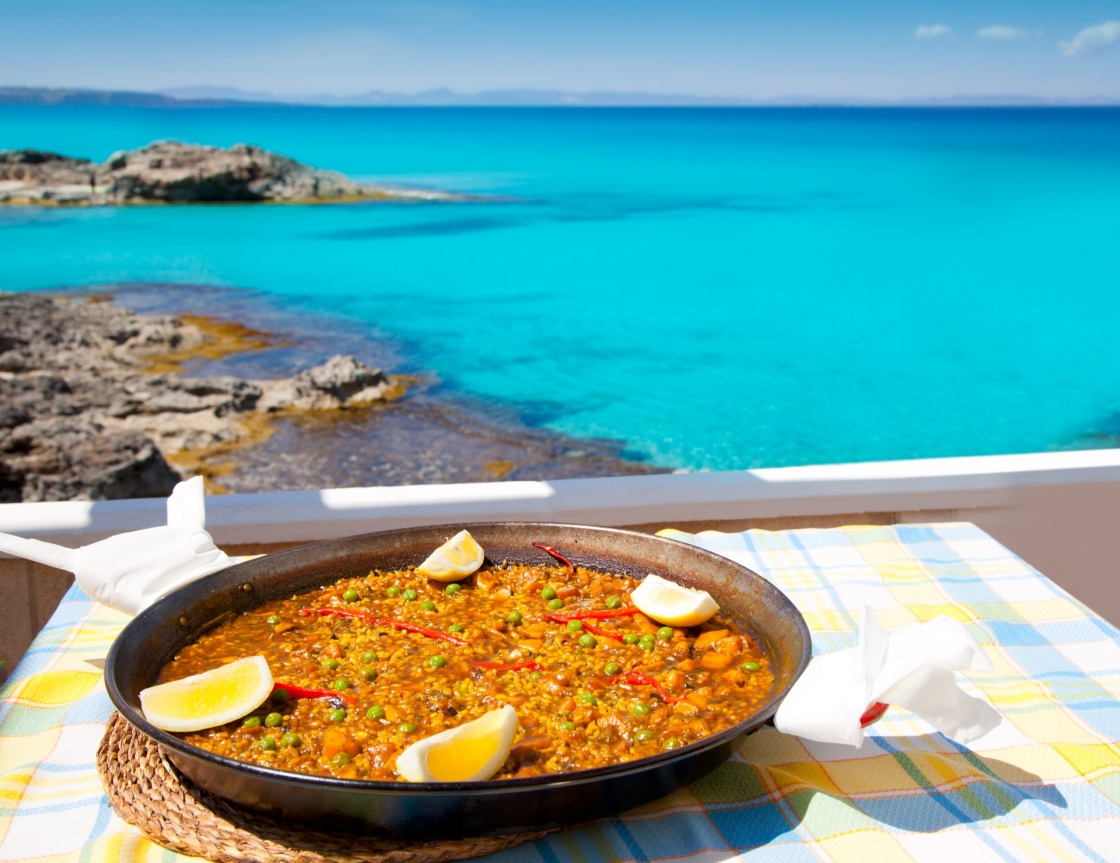 'Paella mediterranean rice food by the Balearic Formentera island beach [ photo-illustration]' - Formentera